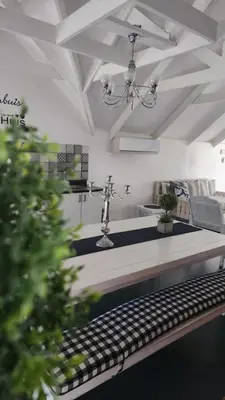 a kitchen with a table and a sink in a room at Be Our Guest Self Catering in Nelspruit