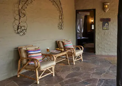 two chairs and a table on a patio at Motswari Private Game Reserve by NEWMARK in Timbavati Game Reserve