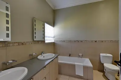 a bathroom with a sink and a toilet at Dunkeld Country & Equestrian Estate in Dullstroom