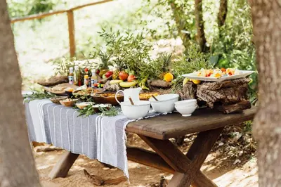 a picnic table with vegetables and fruit on it at Tanda Tula Safari Camp in Timbavati Game Reserve
