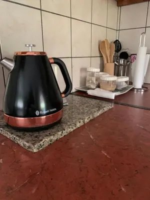 a tea kettle sitting on a counter in a kitchen at Nightjar Guest Lodge in Nelspruit