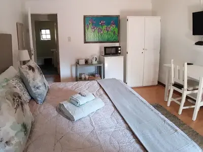 a bedroom with a large bed with two towels on it at Irene B&B in Irene