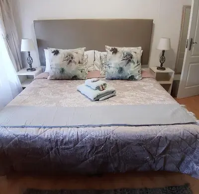 a bed with two pillows and two towels on it at Irene B&B in Irene