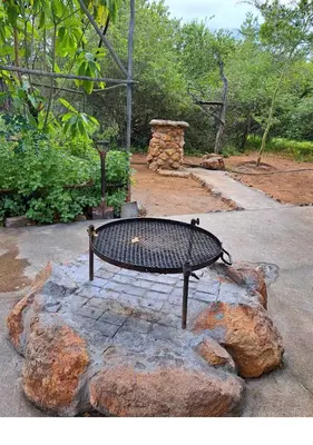 a bench sitting on top of a rock at Lion King in Marloth Park
