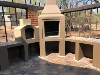 a dog house sitting on top of a patio at Wildgoose Lodge in Marloth Park
