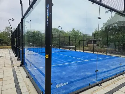 a tennis court with a net on top of it at Seasons Golf, Leisure, Spa in Hartbeespoort