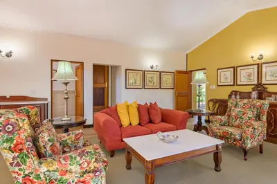 a living room with a couch and two chairs at Protea Hotel by Marriott Polokwane Ranch Resort in Polokwane