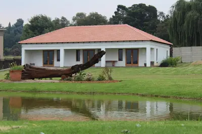 a house with a fallen tree in front of it at Bottom of Boden in Benoni