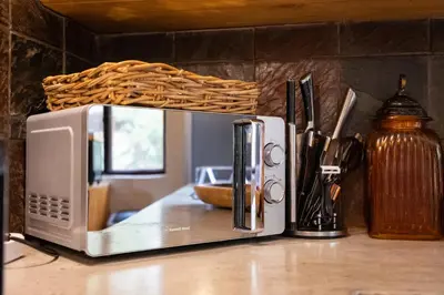 a microwave sitting on top of a counter at Zebra Lodge in Hoedspruit