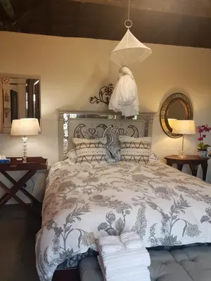 a bedroom with a bed with towels on it at MyAula in Tierpoort