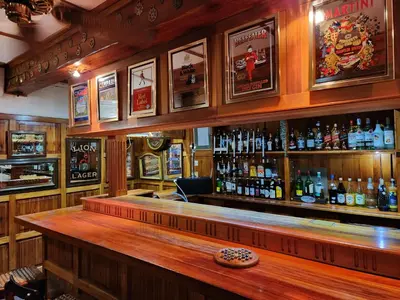 a bar with a lot of bottles of alcohol at Coach House Hotel & Spa Tzaneen in Tzaneen