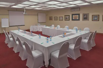 a large conference room with a long table and chairs at Magoebaskloof Hotel in Tzaneen