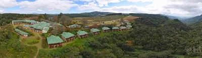 an aerial view of a resort in the mountains at Magoebaskloof Hotel in Tzaneen