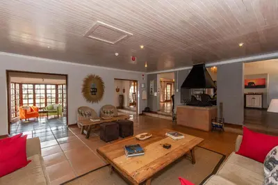 a living room with a couch and a table at Chestnut Country Lodge in Hazyview