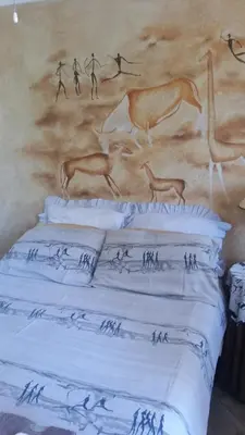 a wall with a painting of animals on it at Vivian's Cottage in Pretoria