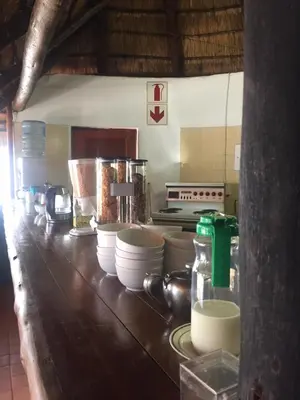 a kitchen with a counter with bowls and utensils at Villa Grande Lodge in Louis Trichardt