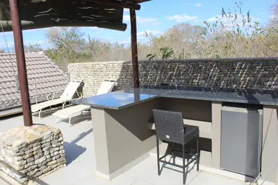 a bar on the roof of a house at Mjejane Bush Camp by Dream Resorts in Hectorspruit