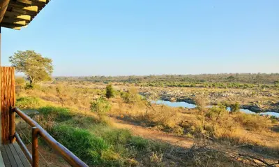 a view of a river from a porch at Mjejane Bush Camp by Dream Resorts in Hectorspruit