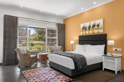 a hotel room with a bed and a window at Park Hotel Mokopane in Mokopane