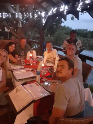 a group of people sitting around a table at Nkomazi Kruger Lodge & Spa in Malelane