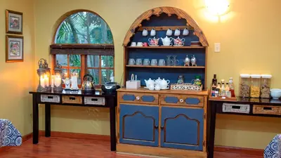 a room with a blue cabinet and a shelf of items at Four Seasons Guesthouses in Lephalale