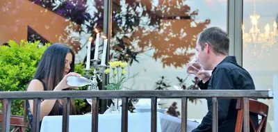a man and a woman sitting at a table at Highgrove House Country Hotel, Restaurant, Farm & Spa in Hazyview