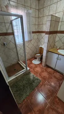 a bathroom with a shower and a toilet at Casa Feliz in Mokopane