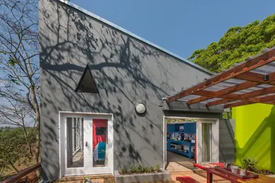 a tiny house with a gray wall at Bluemere Living in White River