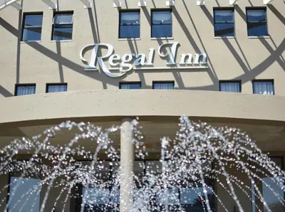 a water fountain in front of a hotel building at Regal Inn Hotel Midrand in Midrand