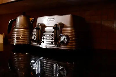 a toaster is sitting on top of a table at Luvivane Luxury Villa in Marloth Park