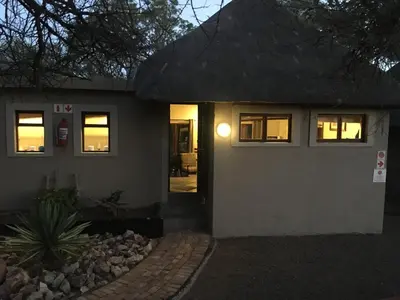 a house with its door lit up at night at Mabalingwe Elephant Lodge in Bela-Bela
