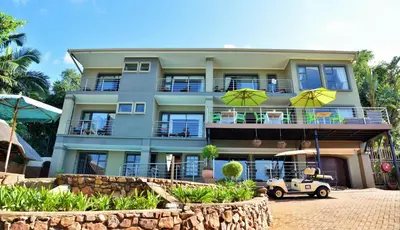 a building with a golf cart in front of it at Stirling Manor Boutique Guest House in Hartbeespoort