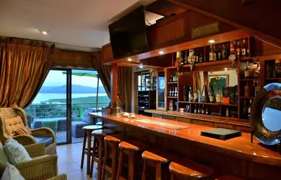a bar in a restaurant with a view at Stirling Manor Boutique Guest House in Hartbeespoort