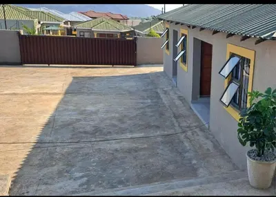 a driveway leading to a house with a plant at BTV Guesthouse in Hazyview