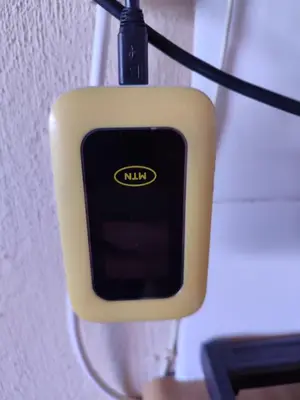a close up of a cell phone hanging from a wall at Marigold's 37 Critchley Common in Dullstroom