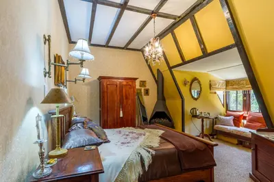 a bedroom with a large bed in a room at Kilmorna Manor Guest House in Schoemanskloof