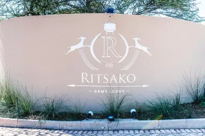 a sign for the rtkka game lodge at Ritsako Game Lodge in Klipdrift