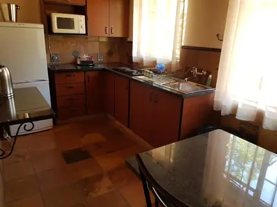 a kitchen with a sink and a counter top at Blyde Canyon, A Forever Resort in Matibidi