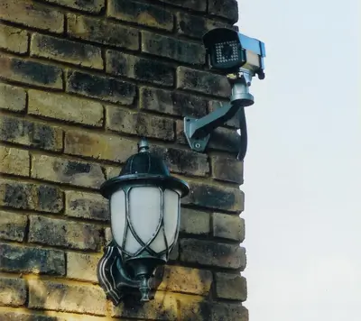 a street light attached to a brick wall at Falling Feather Inn in Pretoria