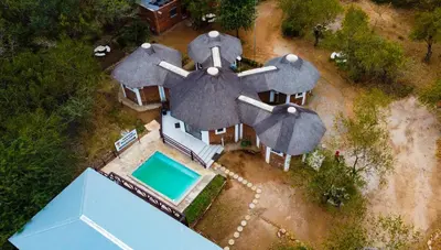 an aerial view of a house with an airplane at Nanisto Bush Lodge in Marloth Park