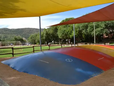 a large dip in the ground under a tent at Mount Amanzi in Hartbeespoort