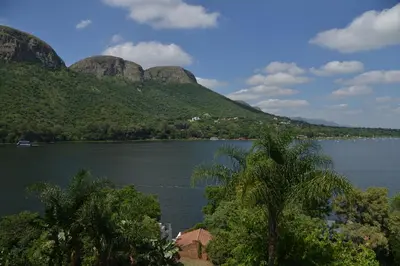 a view of a lake with mountains in the background at The Shore House in Hartbeespoort
