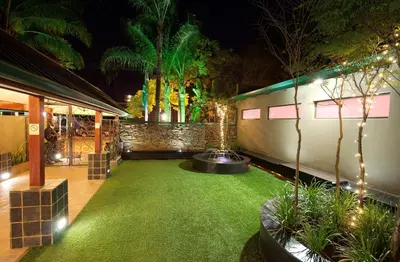 a room with a green yard with lights at Hotel 224 & Apartments in Pretoria