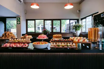 a buffet with many different types of cakes and pastries at Hotel 224 & Apartments in Pretoria