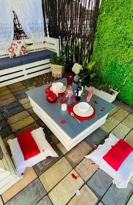 a table with plates on it on a patio at Ledumo Guest lodge in Witbank