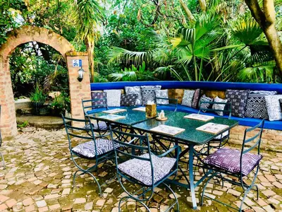 a table and chairs sitting on a patio at Shangri-La Country Hotel & Spa in Modimolle