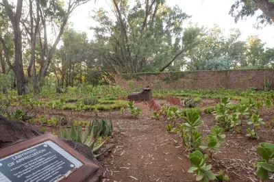 a garden with a sign in the middle of it at Shangri-La Country Hotel & Spa in Modimolle