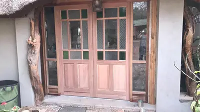 a wooden door on the side of a house at Weltevreden Country Guest Lodge in Groblersbrug