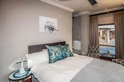 a bedroom with a bed and a window at 7 Saint Andrew in White River