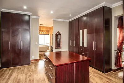 a large room with wooden cabinets and a kitchen at 7 Saint Andrew in White River